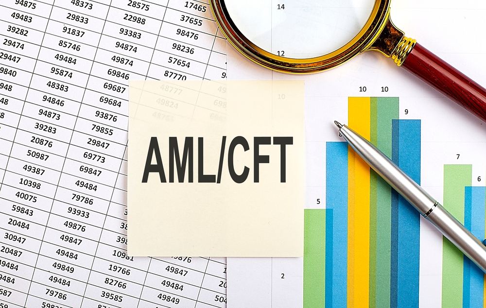 AML/CFT compliance charts with magnifying glass